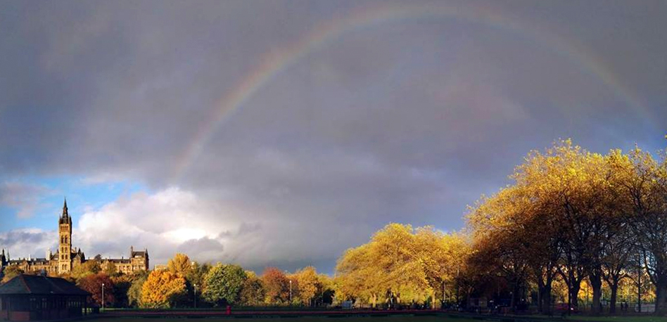 University of glasgow with autumn trees and rainbow