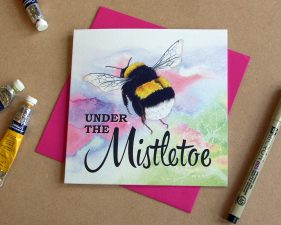 Product shot of bee under the mistletoe card