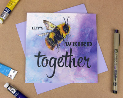 Greetings card with text saying 'Let's be weird together' with a bumblebee replacing the word 'be'