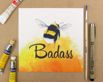 Print showing a bumblebee above the word badass on yellow watercolour background. Forming the phrase Be badass.