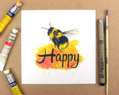 Print showing a bumblebee above the word happy on yellow watercolour background. Forming the phrase Be happy.